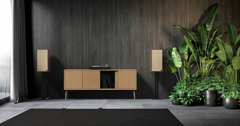 Klipsch The Nines powered speakers on stands flanking a turntable