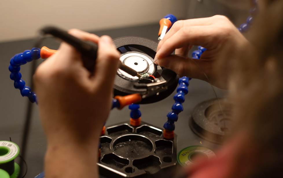 Isaac working on headphone