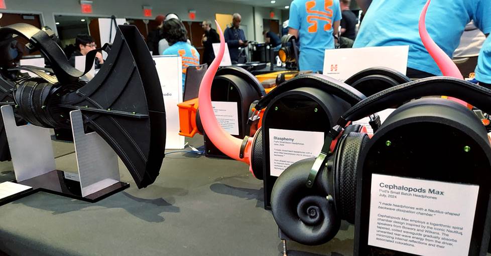 several of PUG's crazy headphones on a table