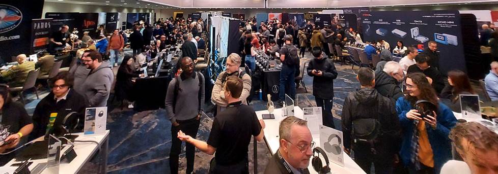 image of the floor of the show with exhibitors and attendees.