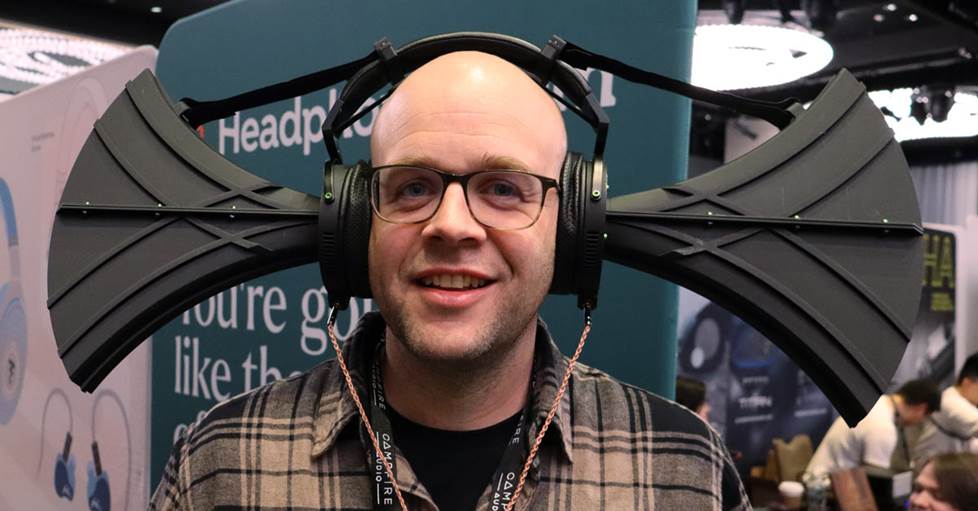 Jeff wearing enormous headphones with two horn speakers pointed at his ears