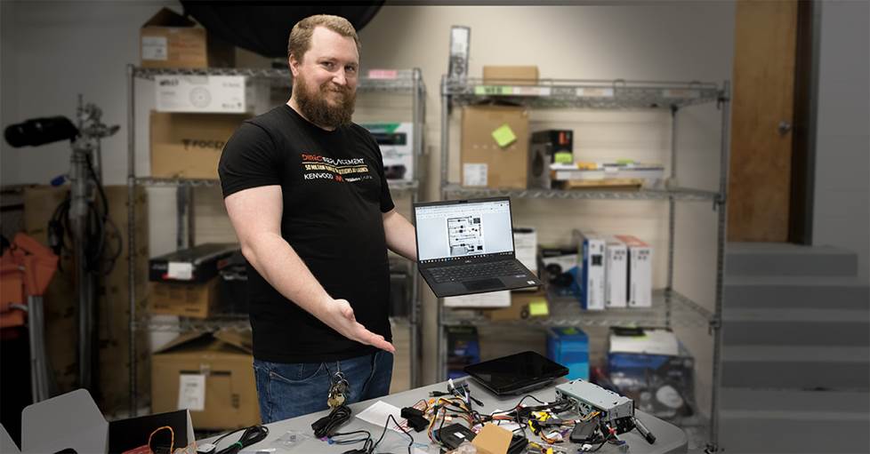 Mulligan working with laptop in hand