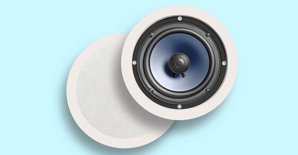 Polk RC60i moisture-resistant in-ceiling speaker on a blue background.
