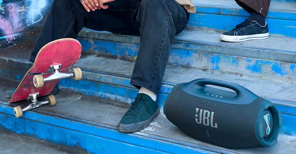 A skateboarder with the JBL Boombox 4