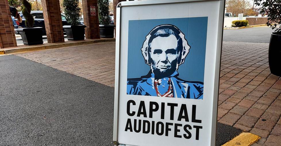 A Capital Audiofest sign in front of the hotel