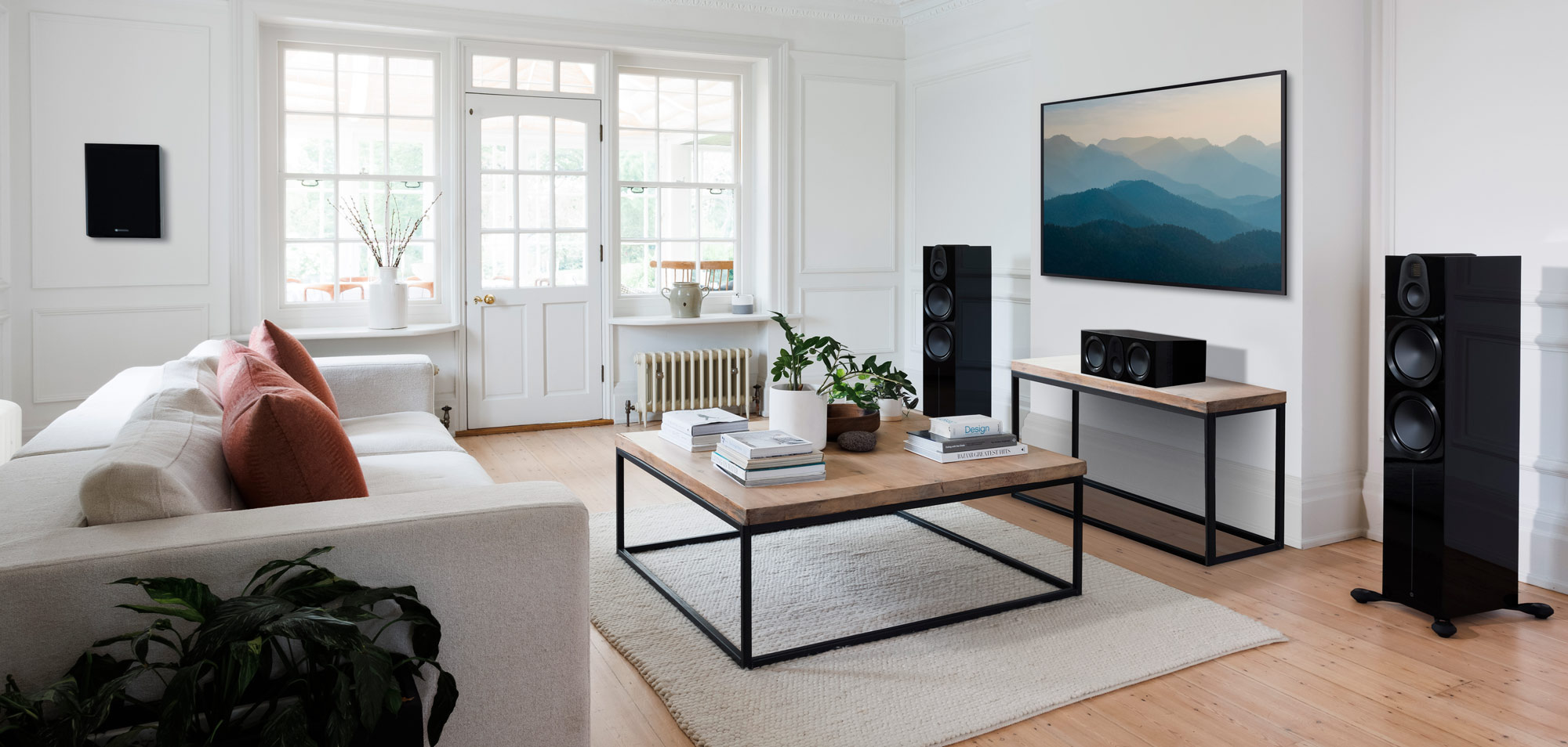 A modern living space featuring Monitor Audio speakers