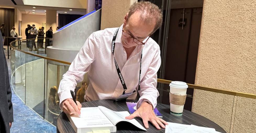 Dr. Sean Olive signing his book for Jeff at CanJam