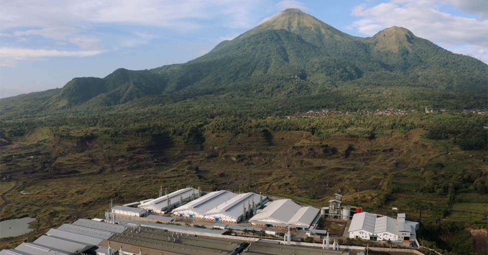 An aerial view of PRS's Indonesian plant against its mountain backdrop.