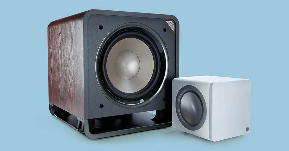 A 6" subwoofer shown next to a 12" subwoofer for scale