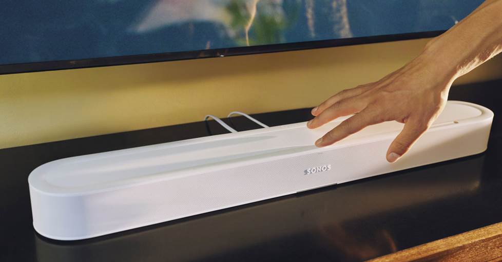 Sonos Beam Ultra sound bar speaker below a wall-mounted TV
