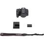 Canon EOS Rebel T8i (no lens included) Shown with included camera strap, battery, and charger