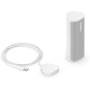 Sonos Roam 2 Shown with matching Sonos wireless charger