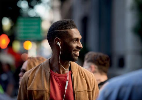 image of man wearing Bose QuietComfort 20i headphones