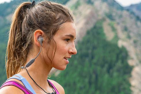 Woman wearing X4  wireless headphones