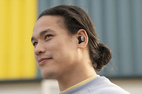 Person wearing Sennheiser CX true wireless earbuds
