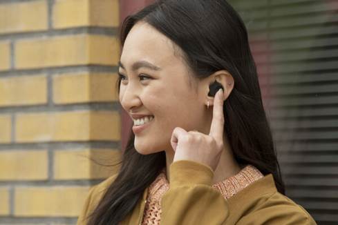 Woman wearing Sennheiser CX Plus earbuds