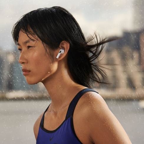 Woman wearing the AirPods 3