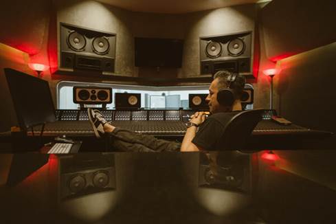 Manny Marroquin in studio with Audeze MM-500 headphones.