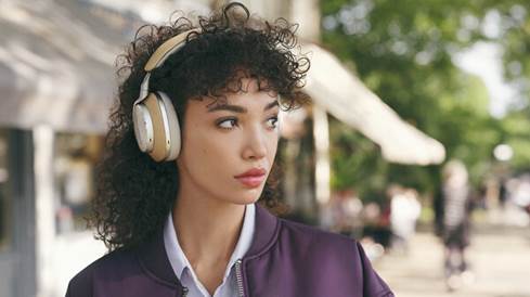 Woman wearing the PX8 Wireless headphones