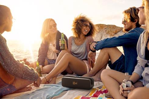 Klipsch Detroit speaker in a beach setting