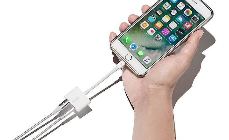 Belkin Audio + Charge Rockstar™ Shown with 3.5mm cable, Lightning cable, iPhone, and hand (not included)