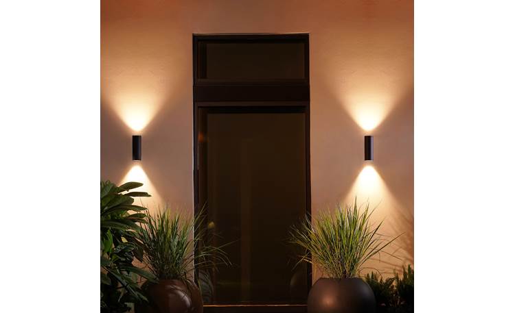 Philips Hue Appear Outdoor Wall Light Lights shine up and down, projecting triangular washes of light on your walls