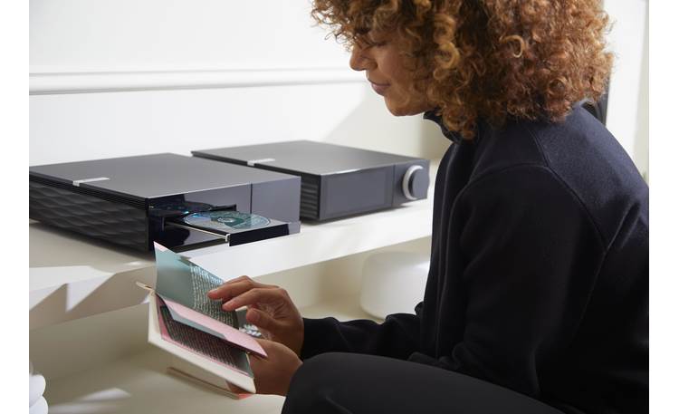 Cambridge Audio Evo CD Shown with wavy black panel and integrated amp (sold separately)