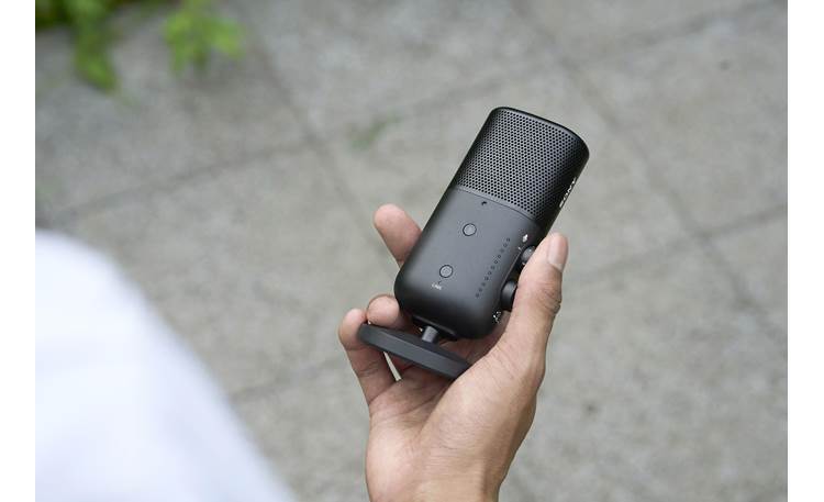 Sony ECM-S1 Microphone with desktop stand, shown in hand for scale