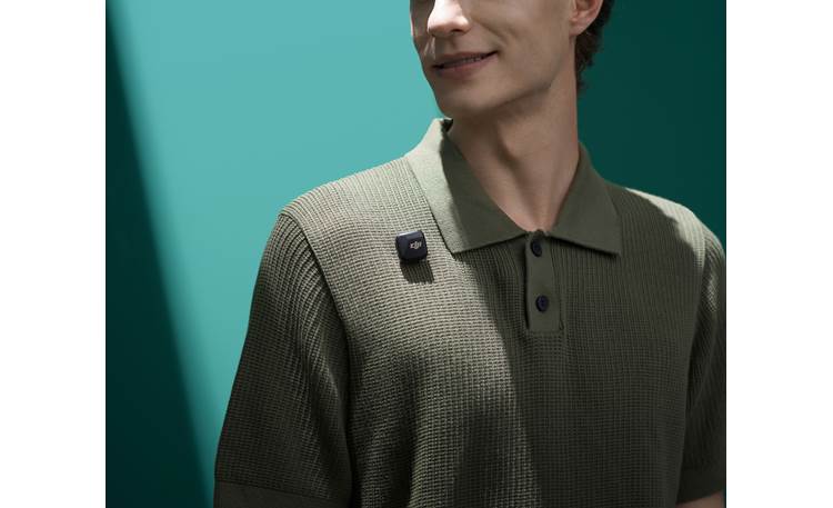 DJI Mic Mini Wireless Mic System Transmitter, shown using magnetic mount through clothing