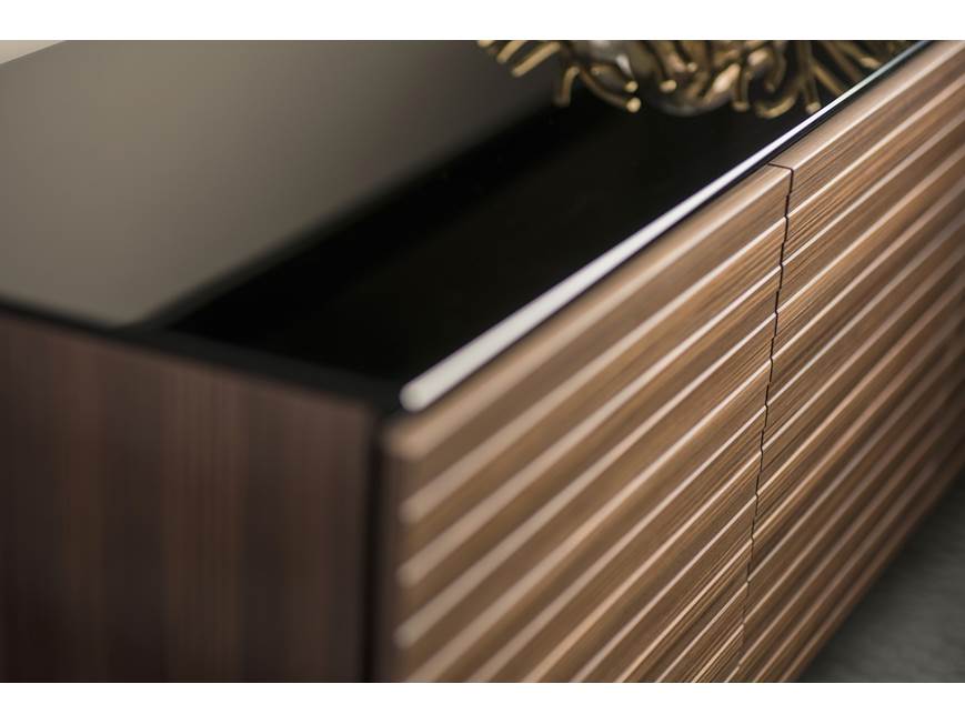 Close-up of striped wooden cabinet veneer and seam