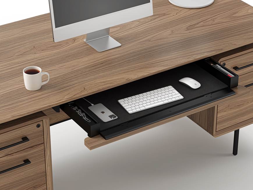 Close-up view of desk top with computer and drawer organizer