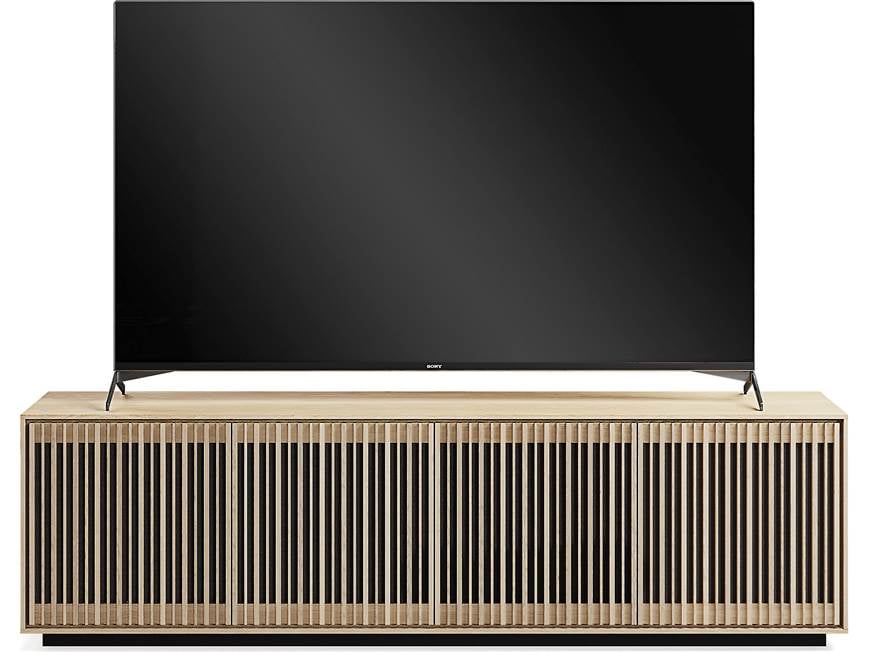 TV on a wooden console with slatted doors
