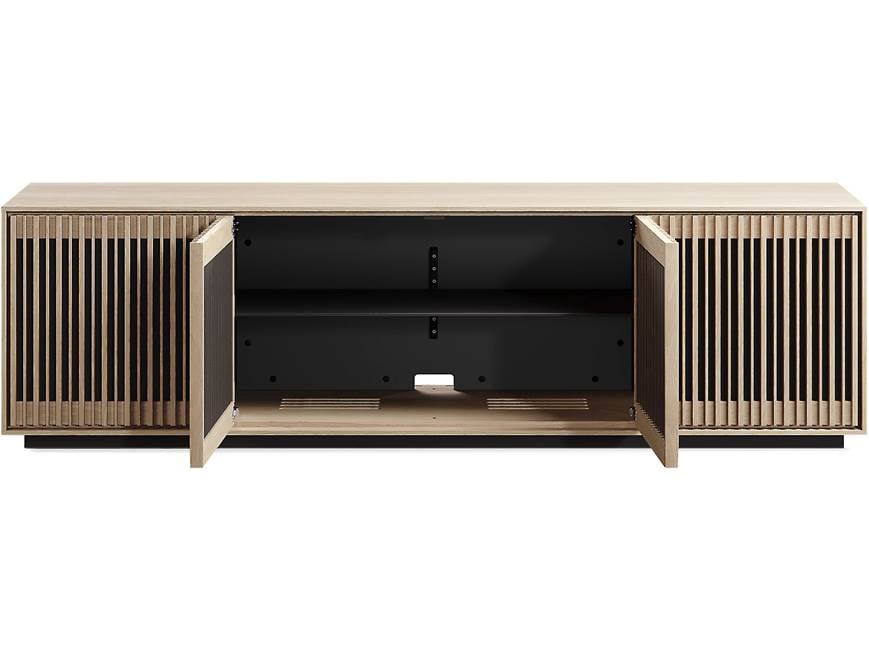 Front of long wooden cabinet with slatted doors