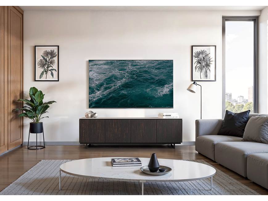 Dark ribbed sideboard under a wall-mounted TV in living room