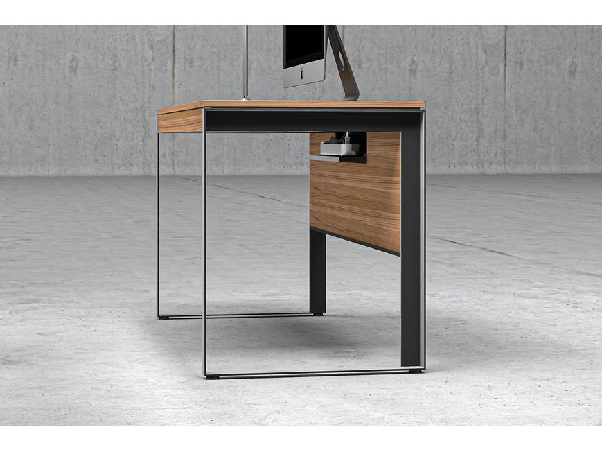 Desk with wood top and metal frame in office setup