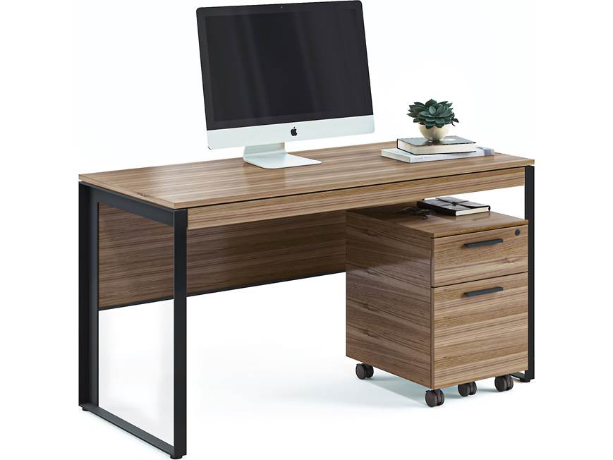 Desk with wood top and black metal frame in office setup