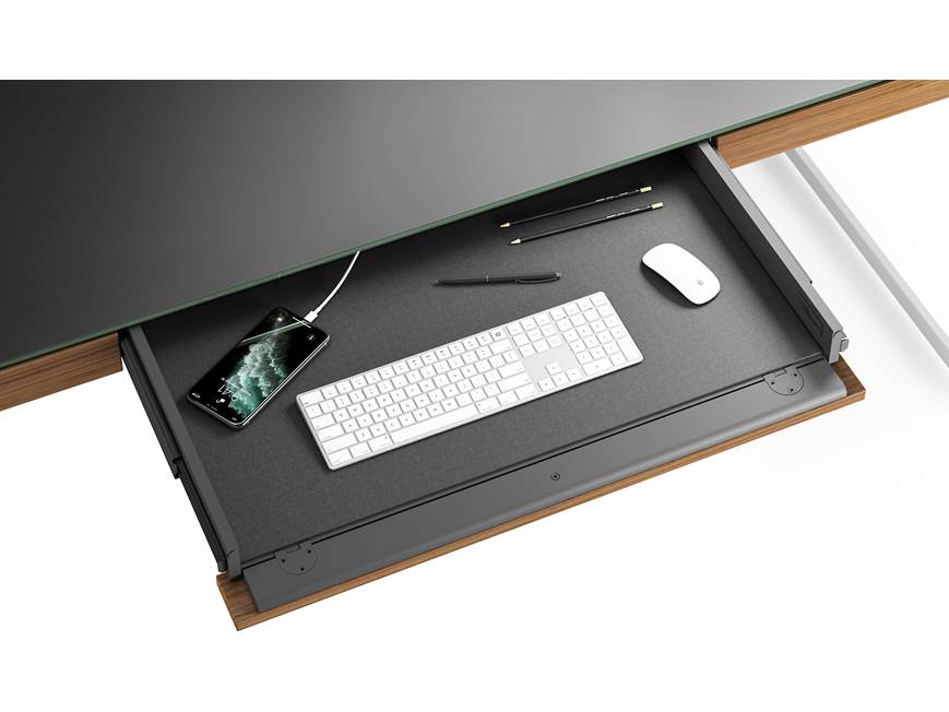 Open keyboard tray in desk