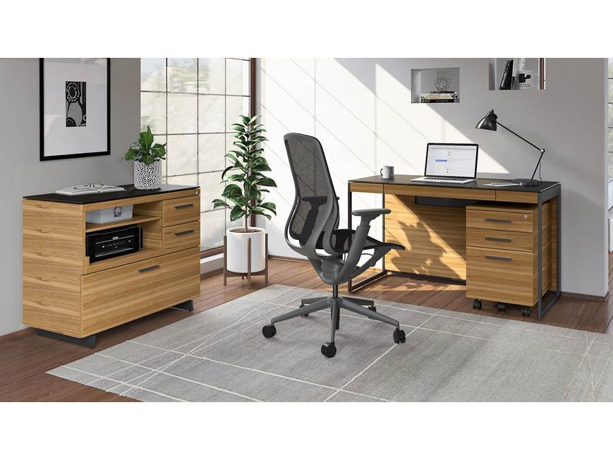 home office with desk, matching cabinets, and office equipment