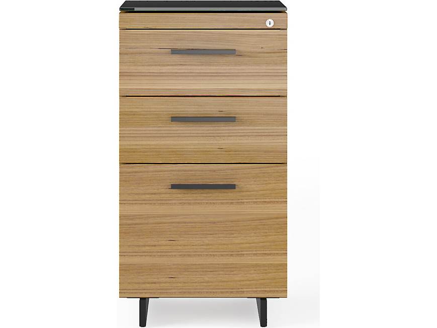 Front view of tall wooden cabinet with four wide drawers and metal handles