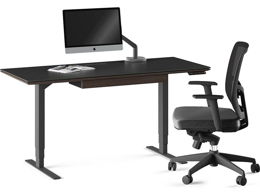 Desk with computer and accessories and office chair