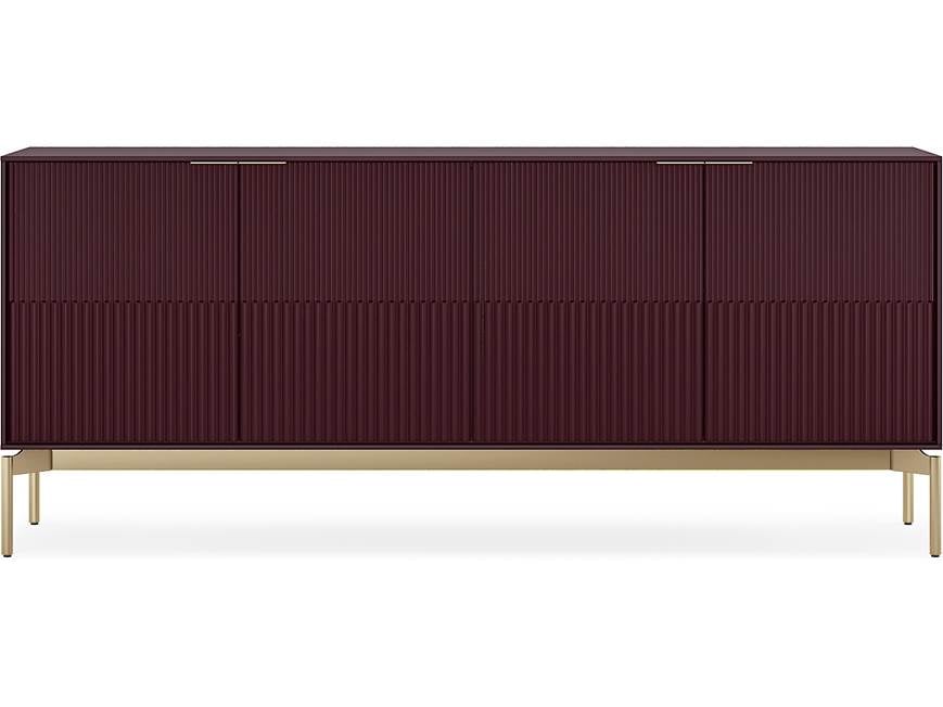 A dark burgundy sideboard with ribbed doors and gold legs