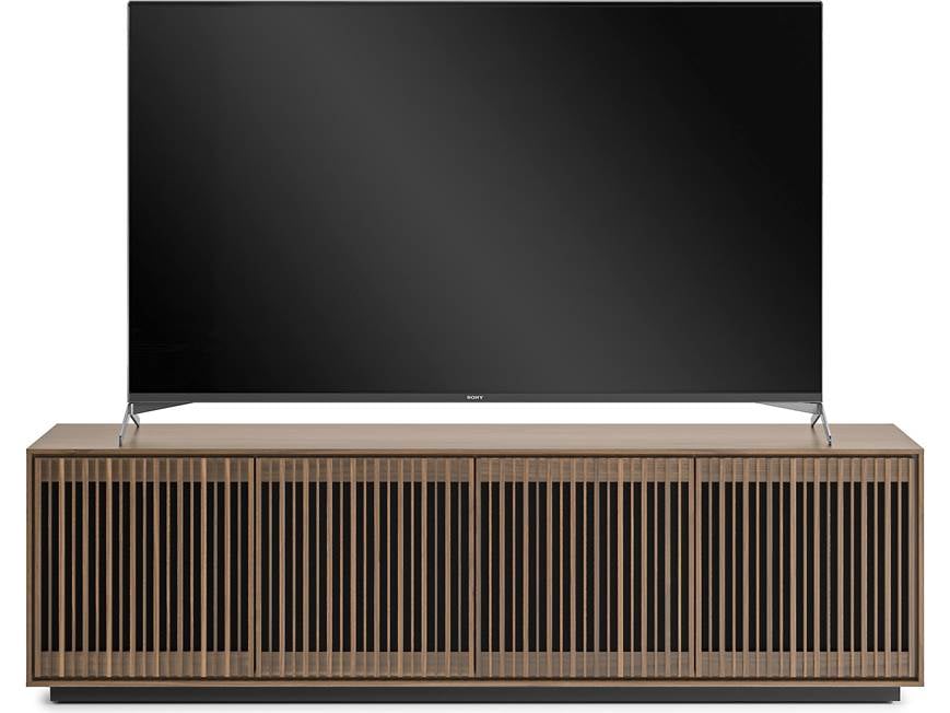 Television on wooden slatted cabinet