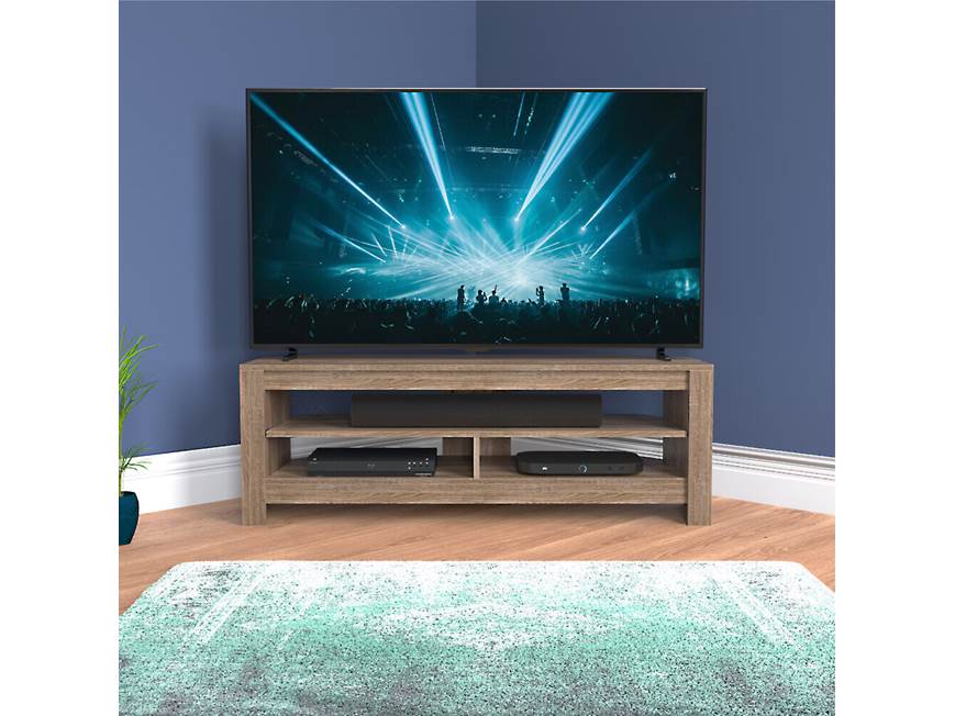 TV stand in a room with blue wall and rug